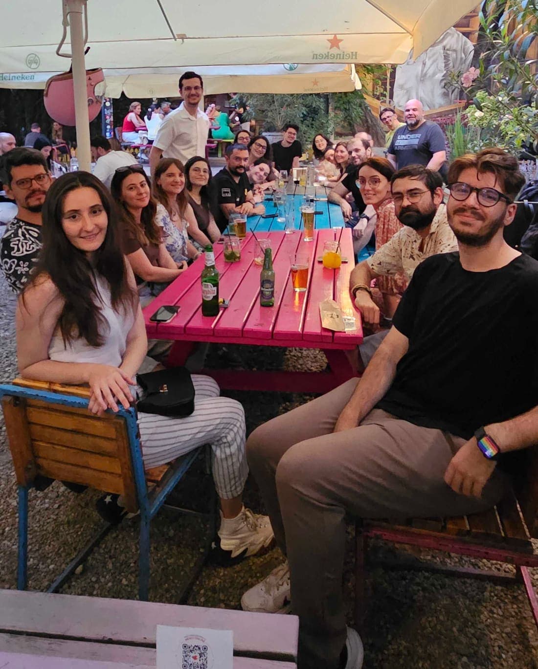 Members around the table at a Product & Design Drinks evening in Bucharest